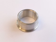 Aluminium spark plug surround